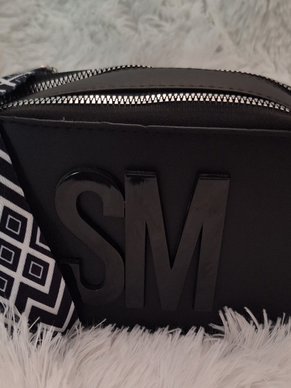 Steve Madden Black Crossbody with Monogram Accent and Patterned Strap
